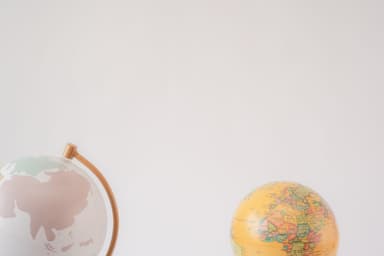 World map and globe representing an international, worldwide patent search