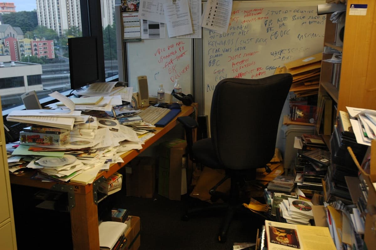 Desk covered in papers during a step-by-step patent search