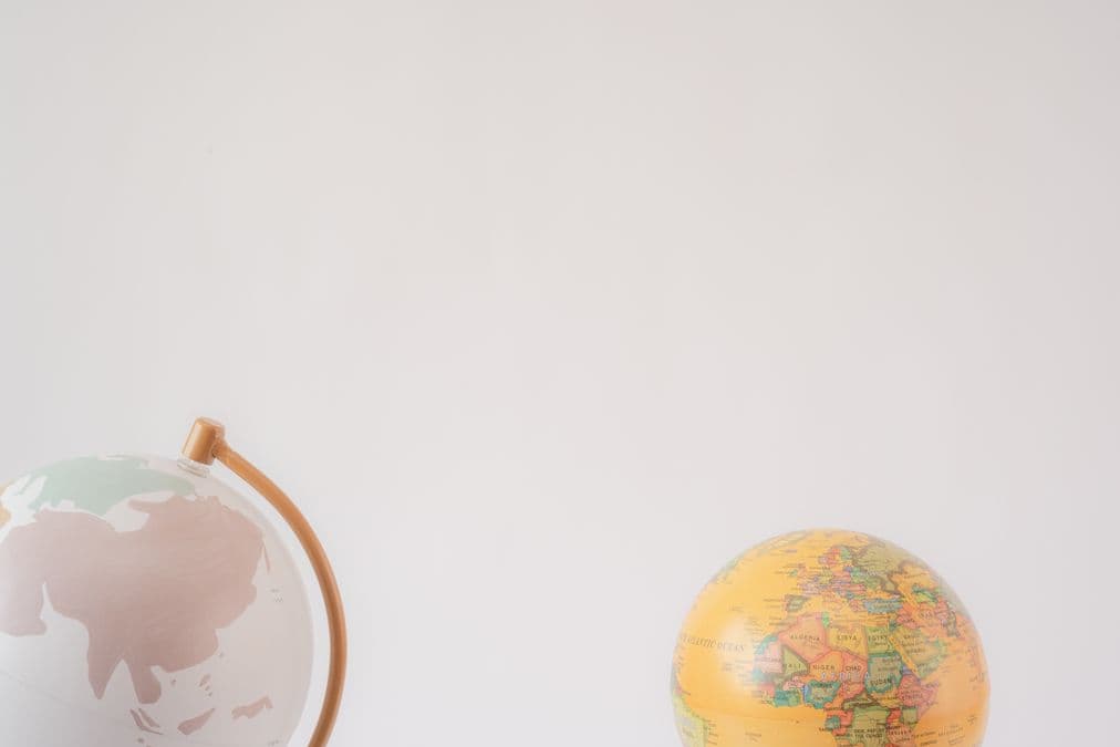 World map and globe representing an international, worldwide patent search