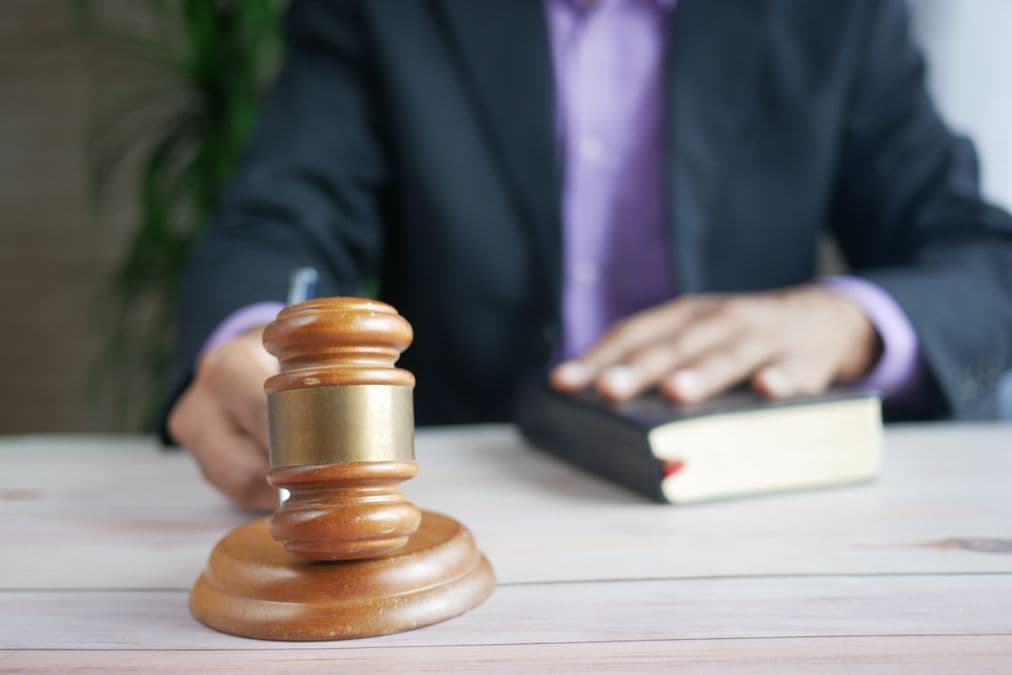 Gavel and law book representing a patent validity or invalidity search