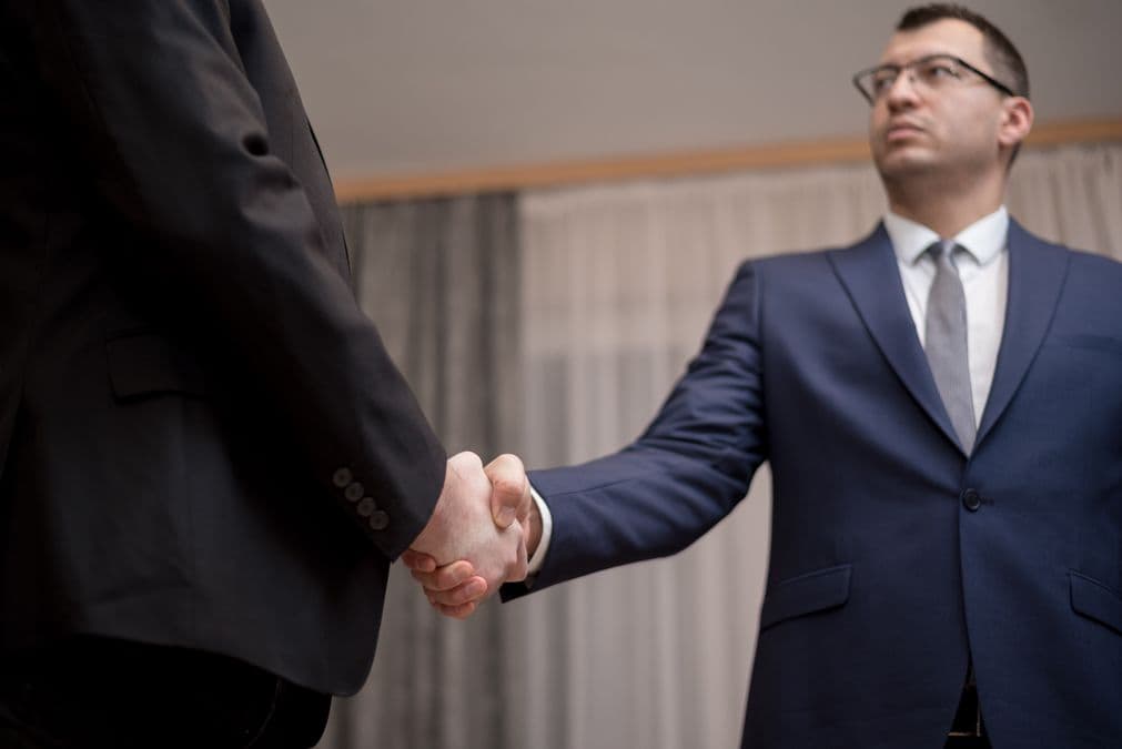 Business handshake representing ways to protect an invention without a patent